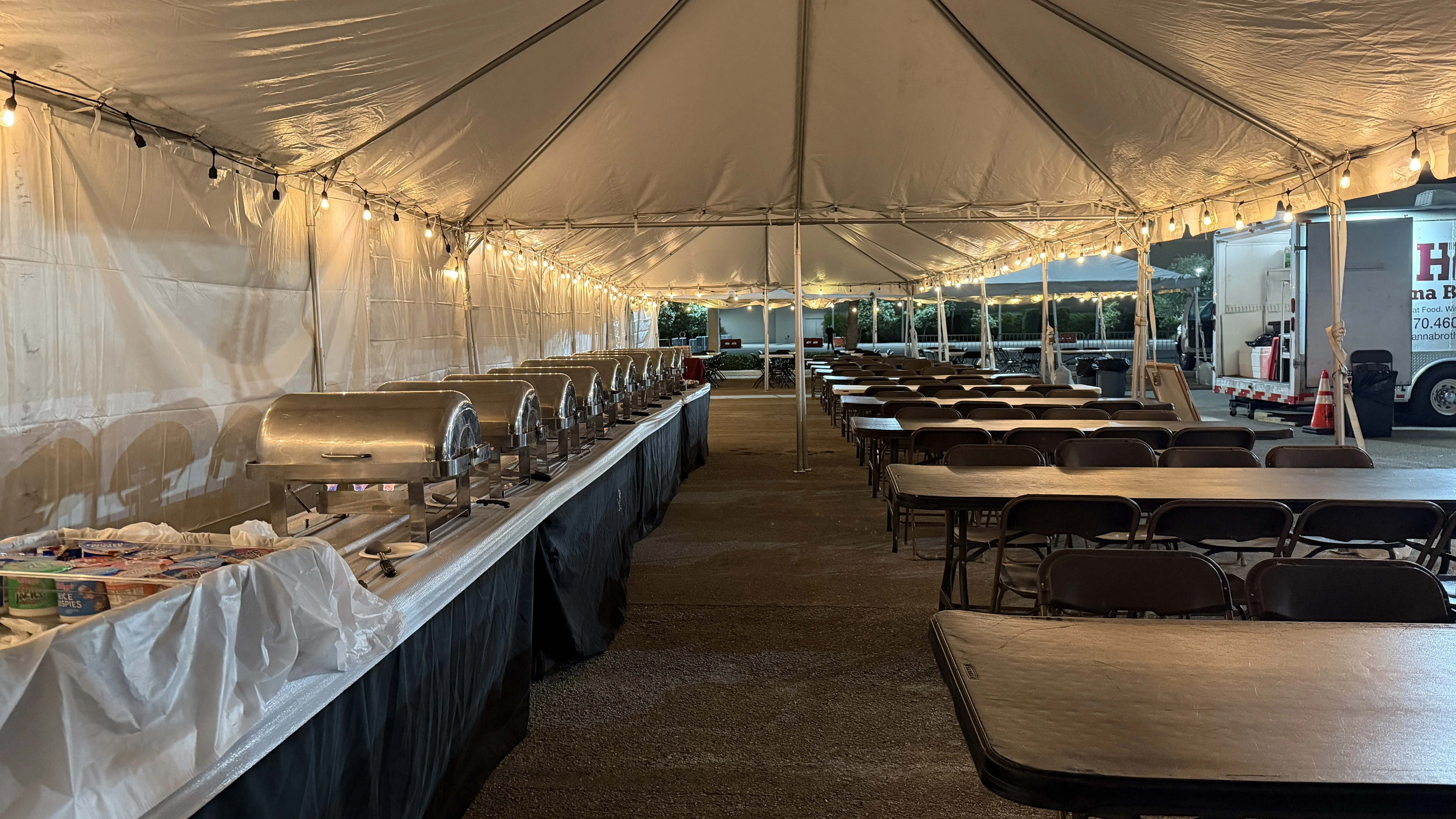 Catering tent interior with buffet and seating