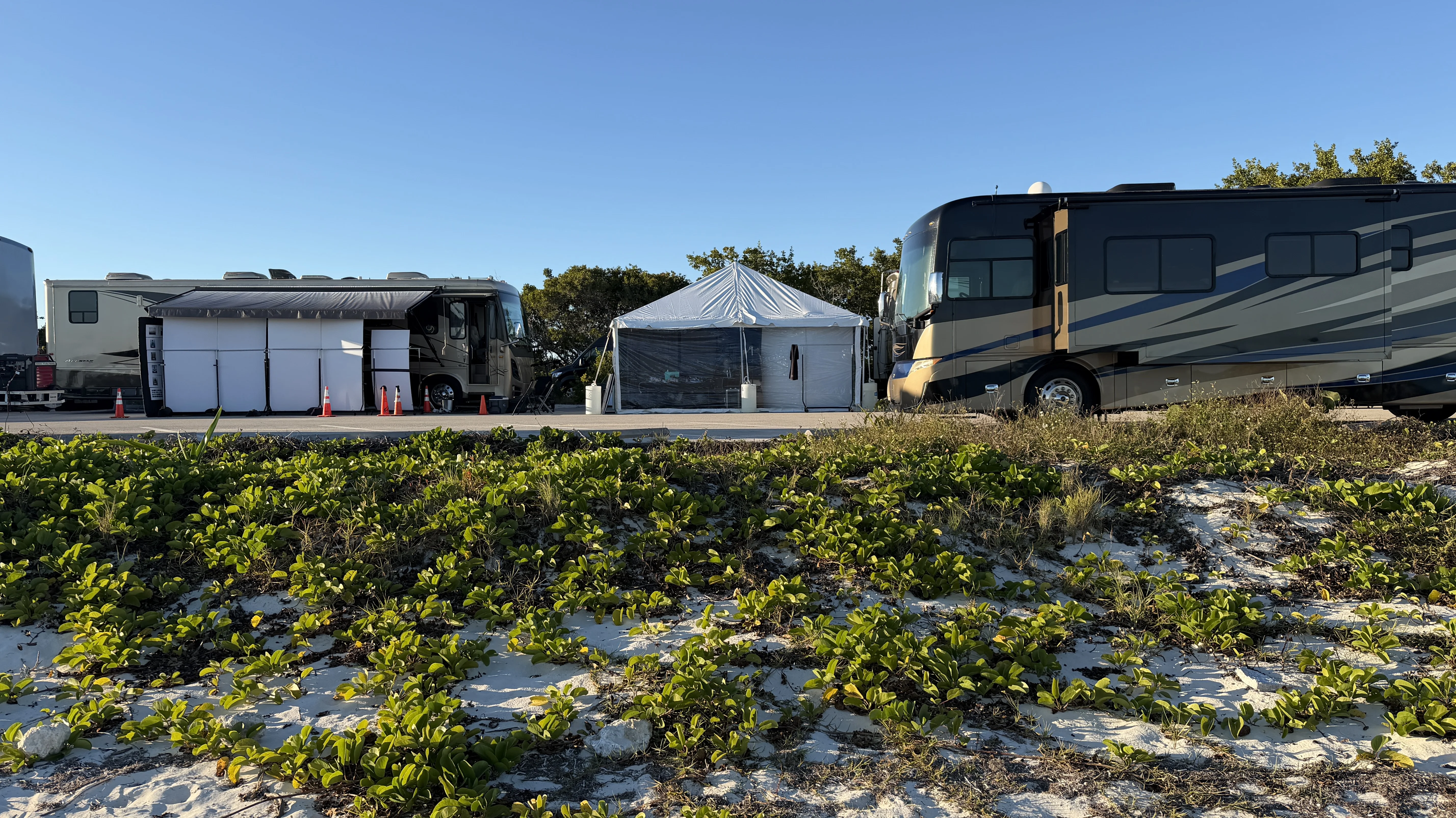 Pipe tent with RVs at beach production